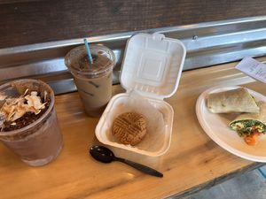 Almond joy smoothie bowl, iced coffee, cookies, breakfast wrap with tofu scramble  at The Station Bistro in Conway