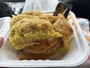 breakfast sandwich with sausage on a biscuit (and some hot sauce 🤭)  at The Station Bistro in Conway