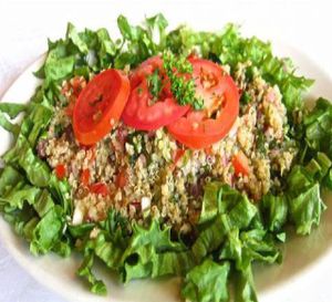 QUI­NOA
A gluten-free quí­noa grain salad made with fresh tomatoes, carrots, cucumbers, red onion, lime, ají amarillo, and herbs; at Aji Peruvian Restaurant in Ooltewah