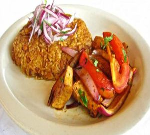 TACU TACU TOFU
Rice and pinto bean patty topped with tofu marinated in an ají amarillo sauce and pan-fried; served with salsa criolla. at Aji Peruvian Restaurant in Ooltewah