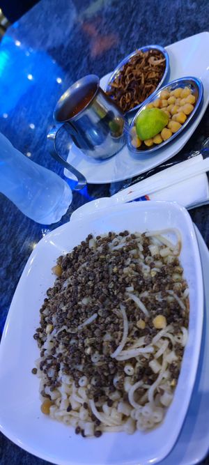 Before using the sauce and you see the additions, lime, chickpeas etc. at Abu Tarek in Cairo