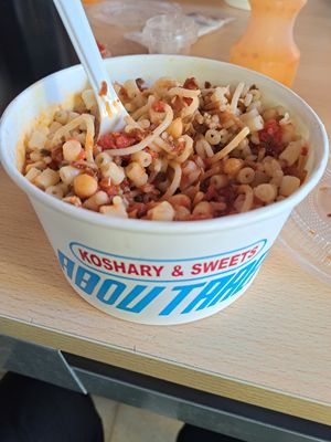 Koshuri with sauces and packaging at Abu Tarek in Cairo