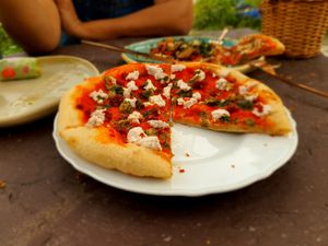 The amazing sourdough pizza with almond ricotta n wild capers. at KaYa Cafe & Guesthouse in Stok