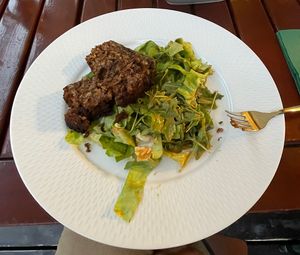 lentil loaf with side salad  at Pilvax Restaurant & Wine Bar in Brasov