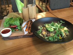 Quinoa bowl and tofu burger with sweet potato fries at The Beginnings - Skolas in Riga