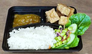 R02. Coated Tofu Curry
Coated Tofu, Homemade Katsu Curry Sauce, Lettuce, Cucumber, Spring Onion, Boiled Rice, (Optional: Crispy Chilli Oil). at BUDDHA TASTE in South East London