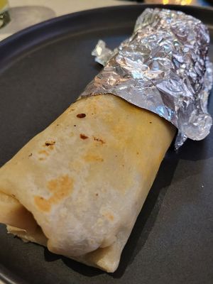 Burrito made vegan without cheese, rice, sour cream, and using black beans... Challenging but tasty in the end at Donkeys - Bambu in San Salvador