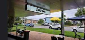 Outdoor seating with a view of the creek at Tuna Tail Poké in Huskisson