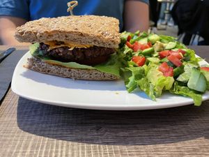 Signature Burger with house salad   at Elysian Plant Based Kitchen Bar in Limassol
