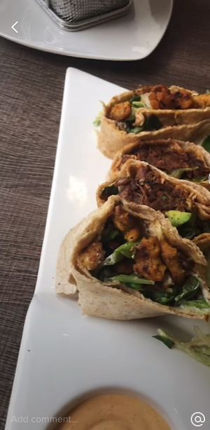 Two types of gyros and burger   at Elysian Plant Based Kitchen Bar in Limassol