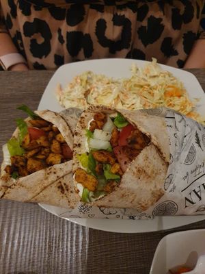 Greek chicken gyros with coleslaw   at Elysian Plant Based Kitchen Bar in Limassol