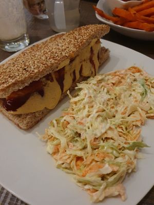 Hotdog and coleslaw   at Elysian Plant Based Kitchen Bar in Limassol