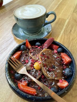Latte and vegan pancakes  at Trip Cafe in Tallinn