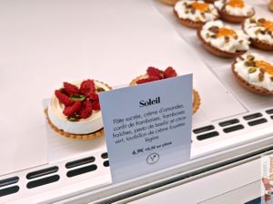  small raspberry tarts with whipped cream. at Clara Jung Pâtisserie in Montpellier