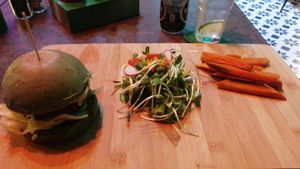 Hawaii burger, with sweet potato fries and healthy salad at The Vegan Table in Bangkok