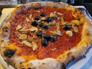 Pizza marinara with added olives and mushroom at Bella Napoli in Orzinuovi