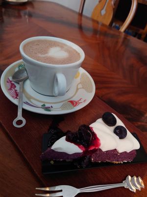 Vegan blueberry cheesecake with hot chocolate (oat milk) at Beans and Tales in Malmo