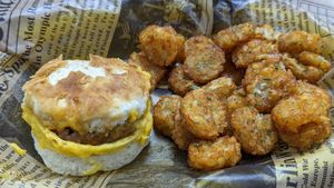 Sausage egg and cheese biscuit with crowns at Atypical Vegan n More in Canton