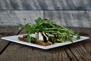 CHEESY GUACAMOLE Ⓥ 
•mild green chile guacamole spread • vegan cheese
microgreens • balsamic drizzle • sea salt at Good Life Organic Kitchen in Red Bank