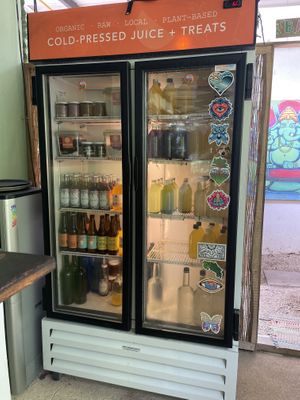 Fridge of goodies, juices, kombucha, etc. at Naked Foods in Nosara