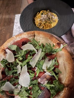fig and prosciutto pizza + carbonara in back   at Coletta in New York City