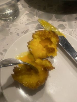 Inside the egg yolk arancini   at Coletta in New York City
