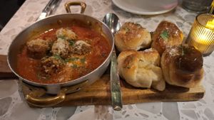 Puttanesca Meatballs with garlic knots. at Coletta in New York City