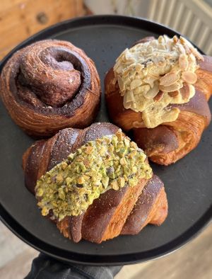 Cinnamon roll, almond croissant and pistachio croissant   at Veg'n'lishious in Leeds