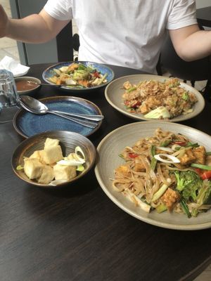 Clockwise top to bottom: tamarind sauce, sweet chilli tofu (?), vegan fried rice, tofu pad kee mao, crispy tofu. Delicious and fresh!  at Camile in Epsom