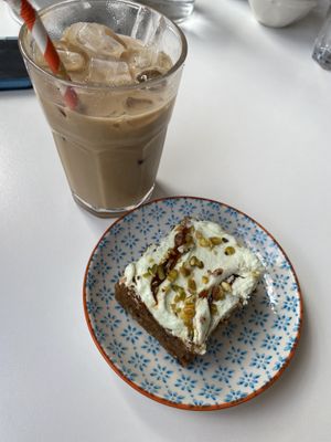 Carrot and pistachio cake, iced latte with oat milk   at Vera Artisan Bakery in Stirling