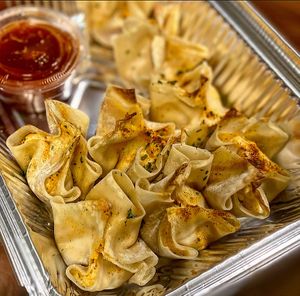 Crab wontons with sweet Thai chili sauce  at The Sweet Botanist Plant Based - Cloud Kitchen in Dallastown