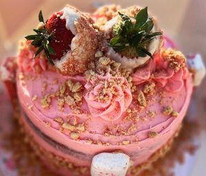 White chocolate strawberry crunch cake  at The Sweet Botanist Plant Based - Cloud Kitchen in Dallastown