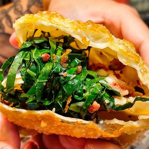 kale pastry (kale, vegetable catupiry, fried garlic, and vegan bacon) at Um Sonho de Coxinha (Cantina Vegana) in Sao Paulo