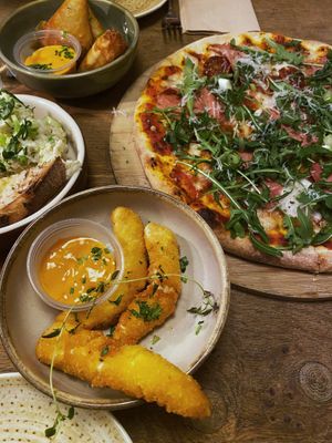 Samosas, ”chicken”, salami pizza, and vegan prawns (we ate one before taking the pic)  at Veganska Ölbaren in Stockholm