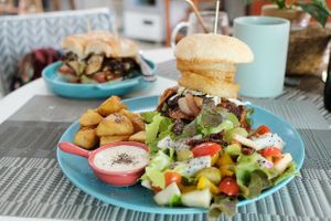 Power burger with salad and fries at Beyond The Root in Khao Lak
