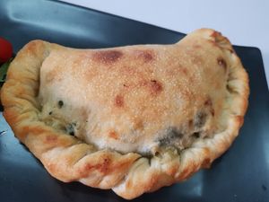 Vegan calzone 400gram.. full of cheese and peppers/ garlic mushroom and ricotta or a tomato sauce with vegetables at Beyond The Root in Khao Lak