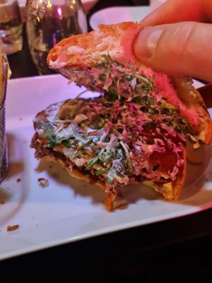 inside of the burger; smothered with sauce  at Klandestine in Basel