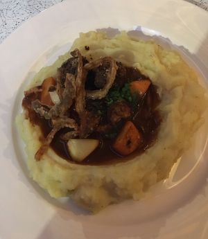 smashed potatoes with meat balls  at Tisch in Vienna