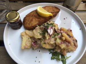 Schnitzel mit Erdäpfelsalat  at Tisch in Vienna