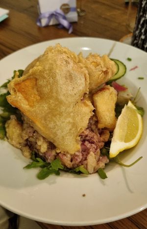 Steirischer Backhendlsalat (dressing a bit oily) at Tisch in Vienna