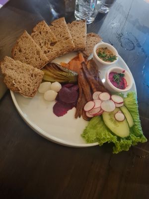 Charcuterie sharing board and schnitzel at Tisch in Vienna