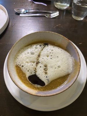 2: pumpkin cream soup with seed oil foam  at Tisch in Vienna