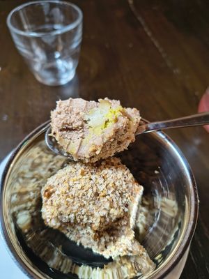 Mozart Eisknödel
Hazelnut-chocolate ice cream balls filled with marzipan, pistachio cream covered in caramelised hazelnut crumbs. at Tisch in Vienna