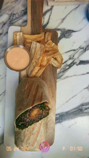 Burrito with quinoa, plantains, kale  at Earthy Picks in Orlando