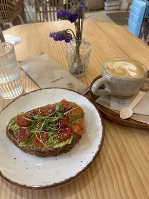 Avocado Toast and Flat White with Oatmilk  at Coco House in Madrid