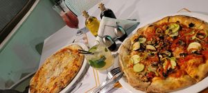 Vegan pizza and vegetarian one at Fourth Island in Ksamil