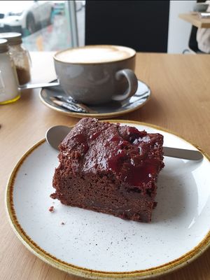 Oat coffee and vegan cherry brownie. at Grounded in the North in Manchester