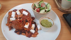 Jacket potato with vegan chilli, feta, guacamole and salad at House of Botanics in Consett