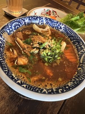Tom Yum with sheet glass noodles  at Anotai in Bangkok
