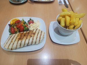 Sauted Mushroom, Chefs Falafel, and Walnut Wrap with a Side of Chips at Two the Square in Conwy